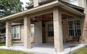 Custom Built Patio Cover with tongue and groove cedar wood stained as the ceiling in The Woodlands, Texas