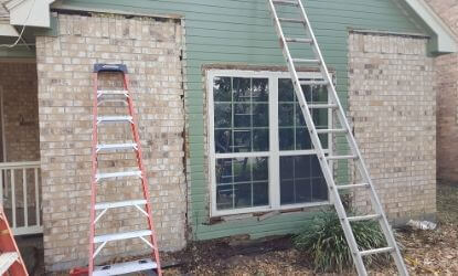 Warped and termite eaten rotted wood siding and trim arounds windows in The Woodlands Texas