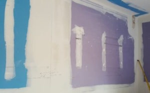interior wall painting with newly floated walls with drywall installation
