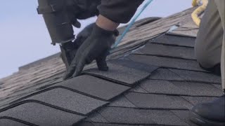 nailing a ridge cap on a shingle roof