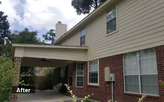 new custom built patio cover in back of house in The Woodlands Texas