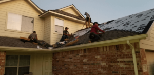 roofers replacing roof and installing new GAF timberline HDZ shingles in Magnolia, Texas