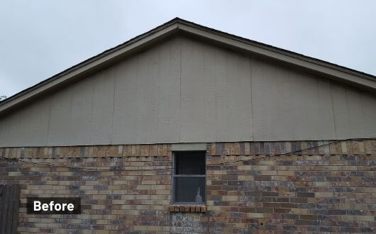 warped wood home siding needing a replacement