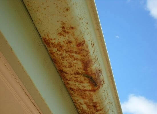 rusted metal gutters - Mr. Happy House
